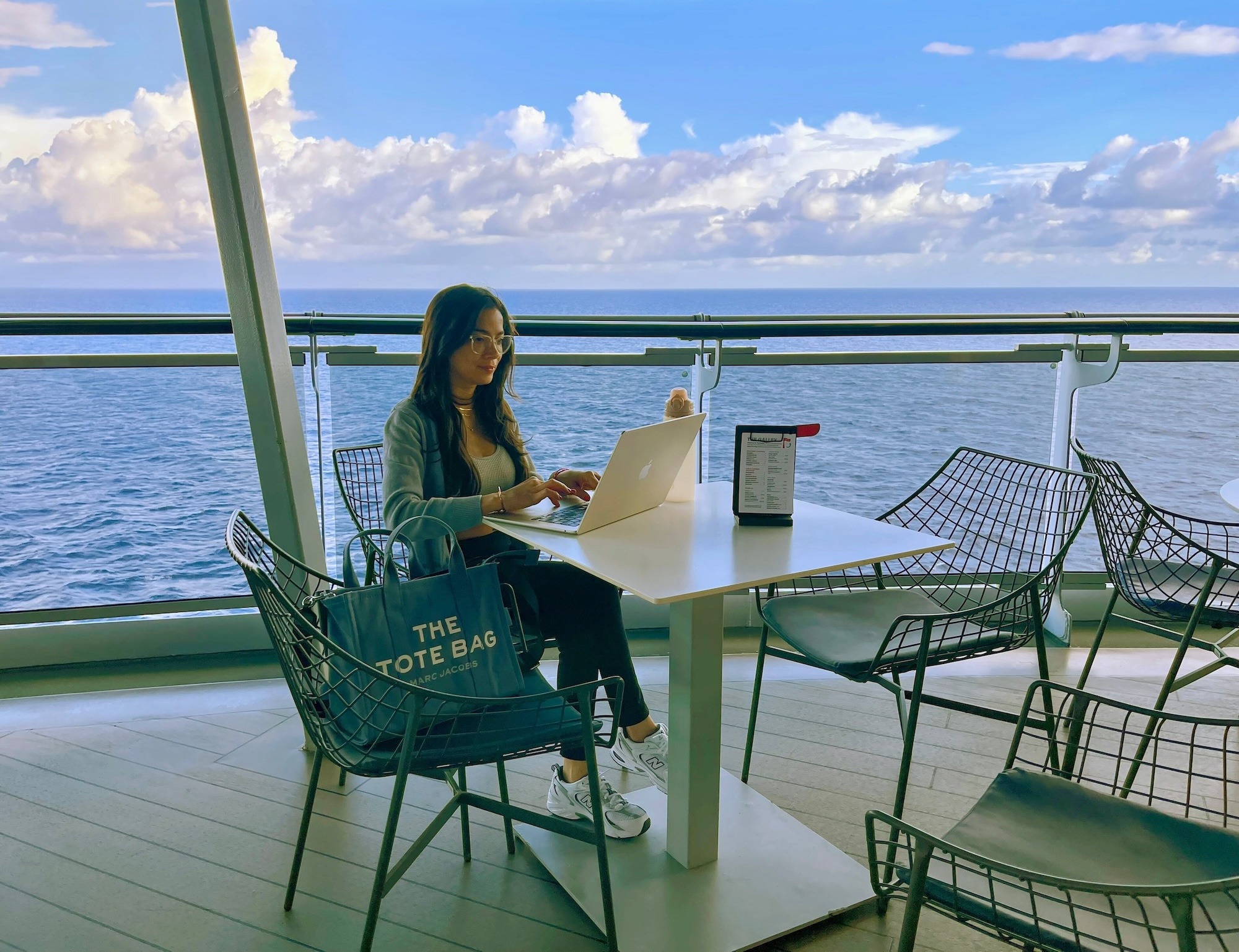 Joenid blogging from the outdoor area of The Galley Virgin Voyages cruise ship