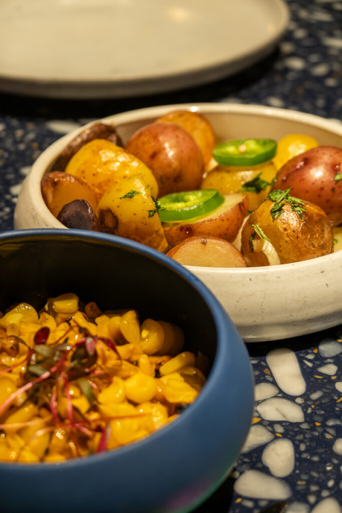 Chorizo Potatoes (no chorizo) and esquites corn from virgin voyages