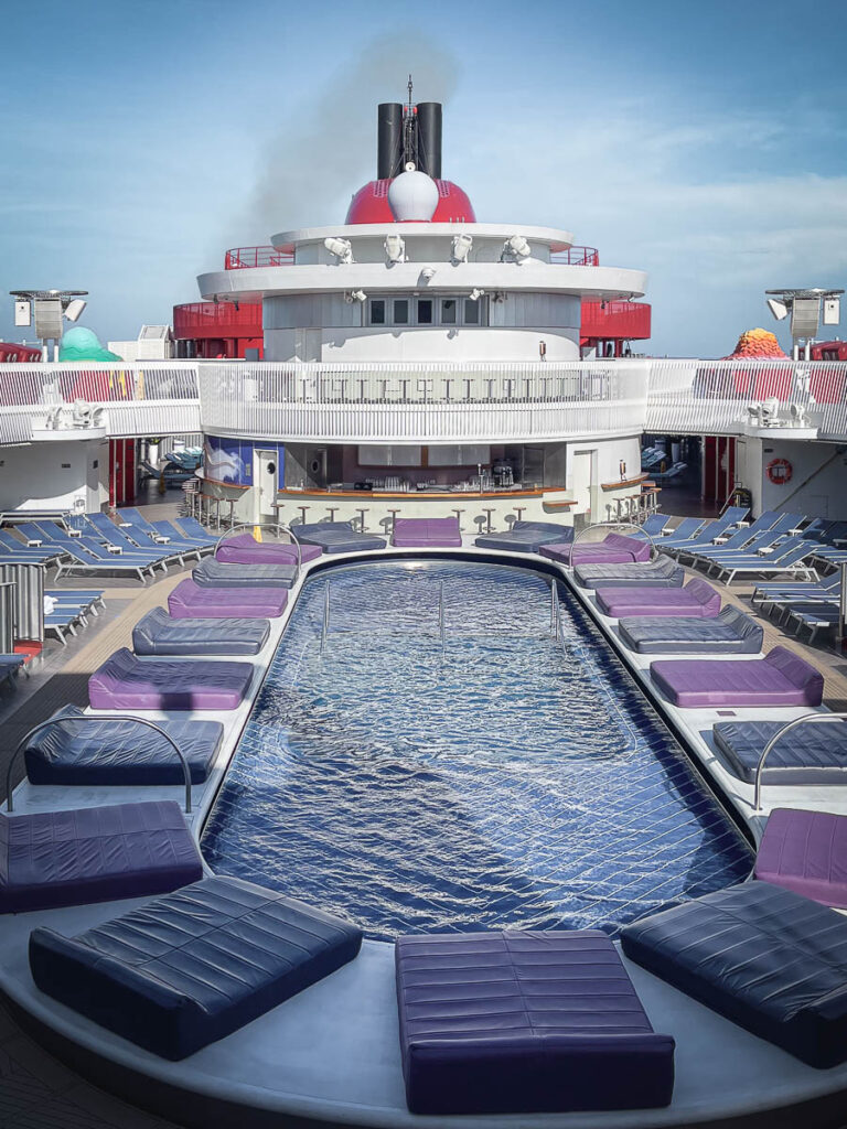 virgin voyages large outdoor pool and pool bar