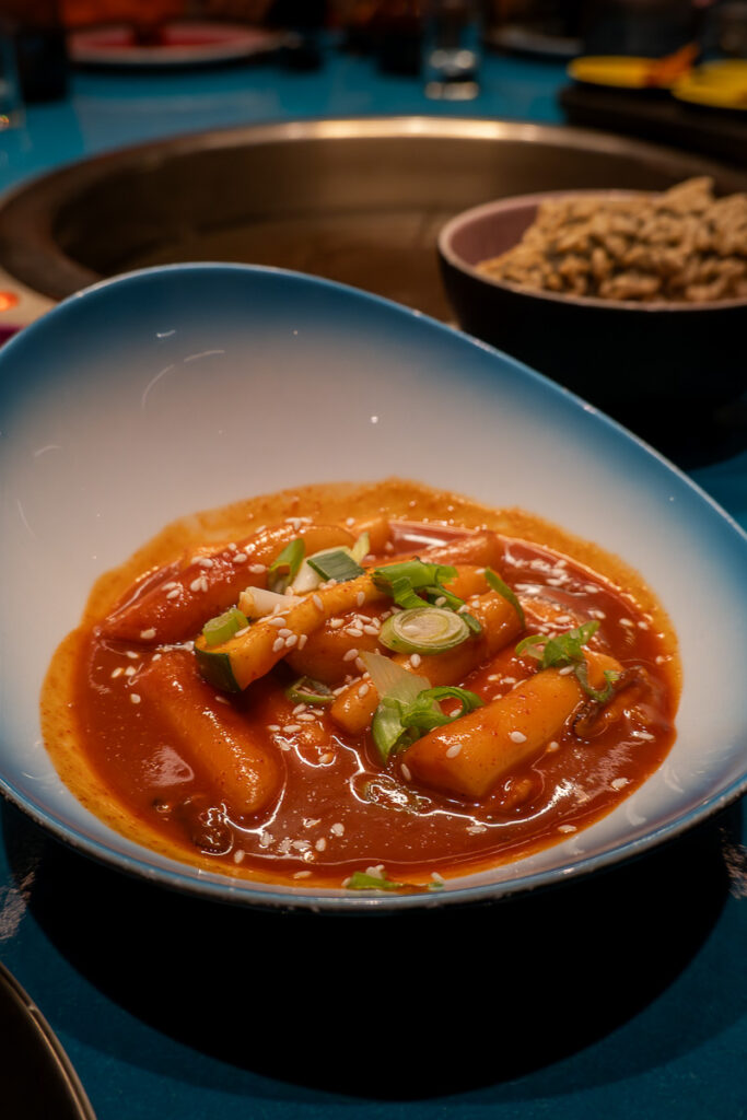tteokbokki spice rice cake zucchini from the gunbae restaurant at virgin voyages