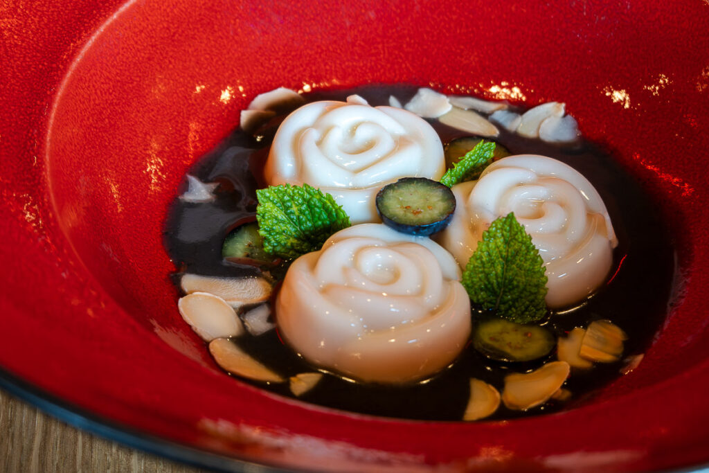 A dessert of Almond Tofu and Black Sesame from Virgin Voyages Lucky Lotus by Razzle Dazzle





