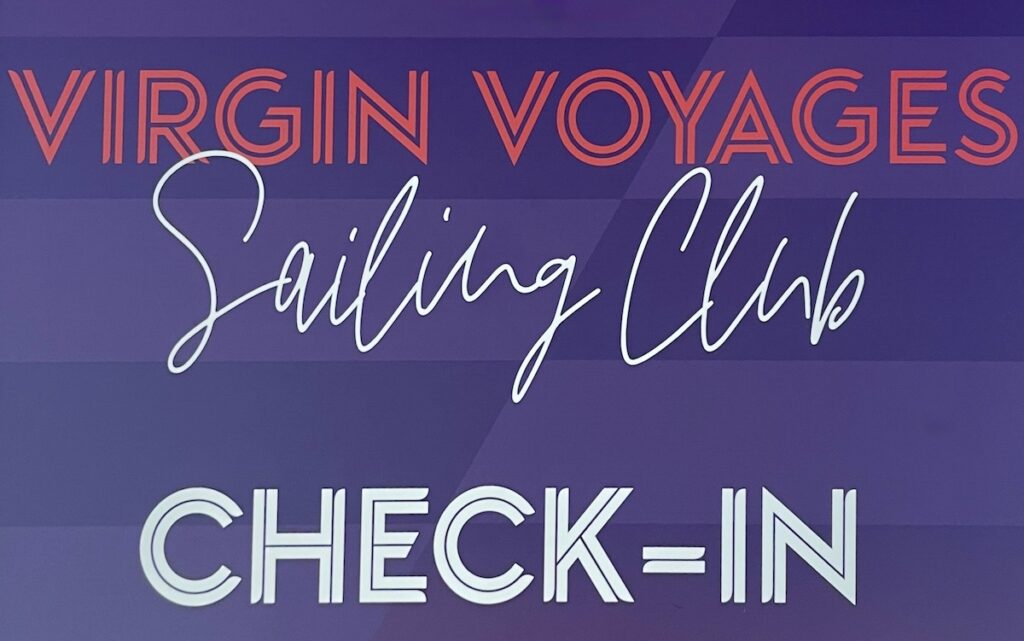 virgin voyages sailing club check-in sign joenidcorner