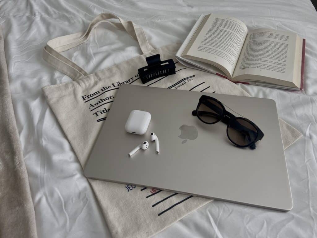 A laptop and airpods to create a blog step by step