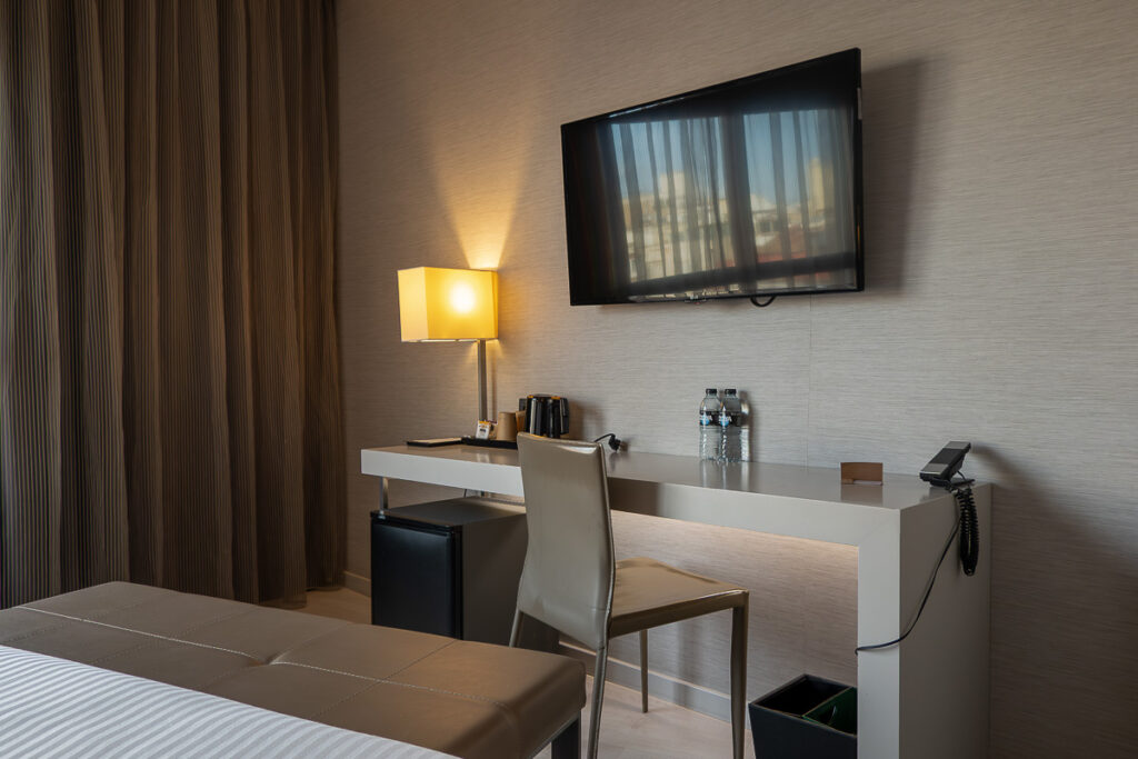 standard room desk, chair and a tv of the best hotel in Valencia Spain