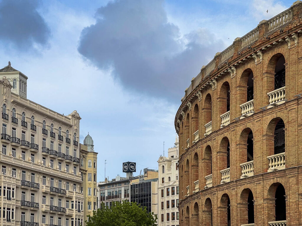 brick building and a view of the SH colon Valencia hotel sign