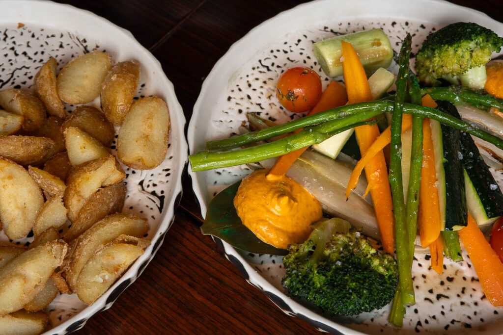 vegetables and patatas bravas from origen tapas concept restaurant offering vegan options in palma mallorca