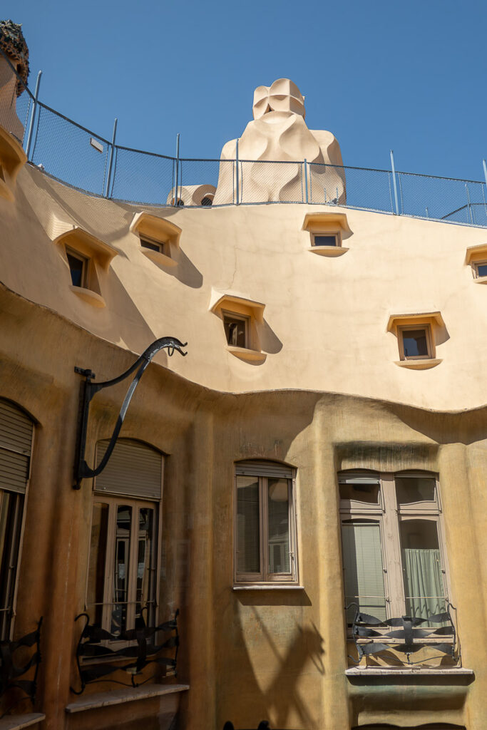 view to the roof of a structure to show the Casa Mila chimney in Barcelona