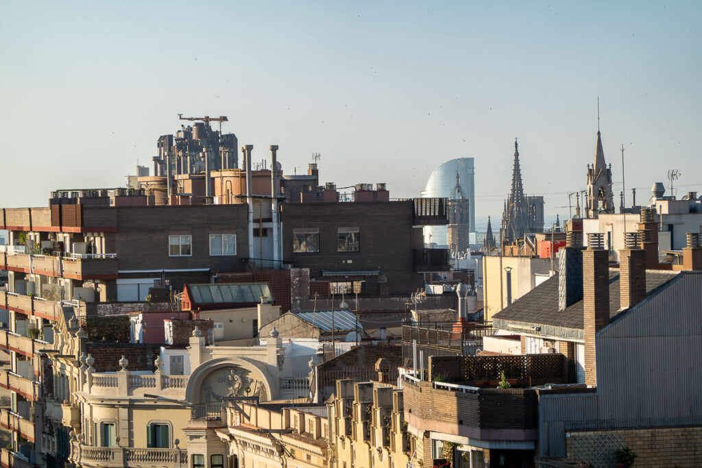 view from the roof to several structures in the historic area of Barcelona Spain which represents the must see in barcelona 1 day 