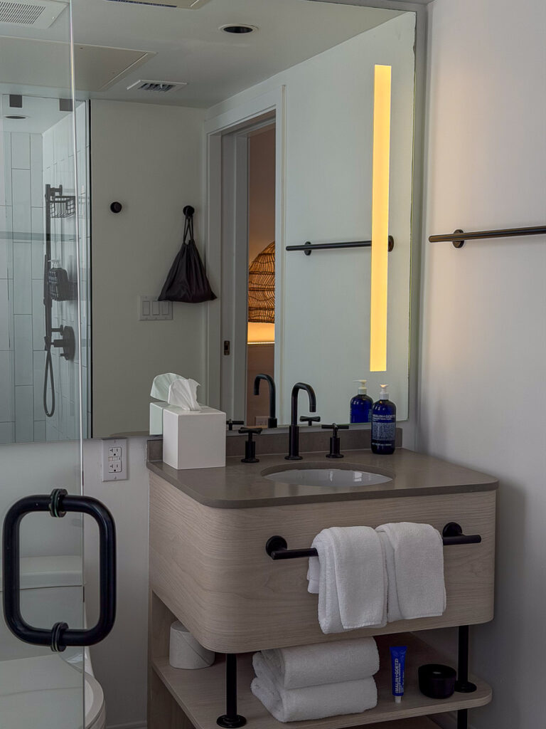 bathroom sink with black fixtures from the courtyard superior king room in the greystone hotel miami beach