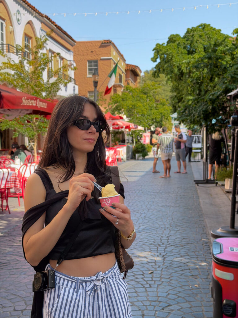 woman eating ciao amore gelato in the during the vegan day trip to miami
