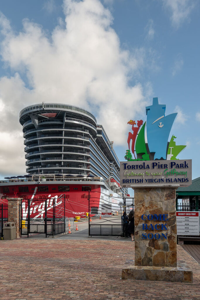 a cruise and the sign of the tortola cruise port in the one day in tortola bvi