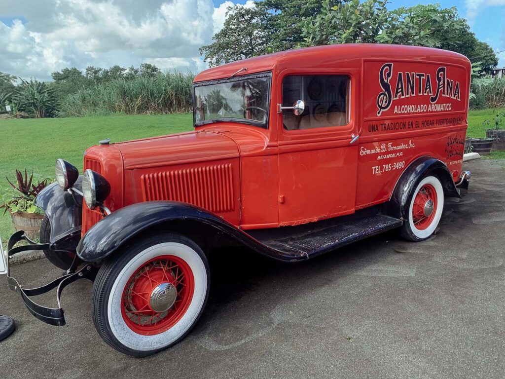 red old car in Ron del Barrilito which is one of the places to visit in one day itinerary san juan