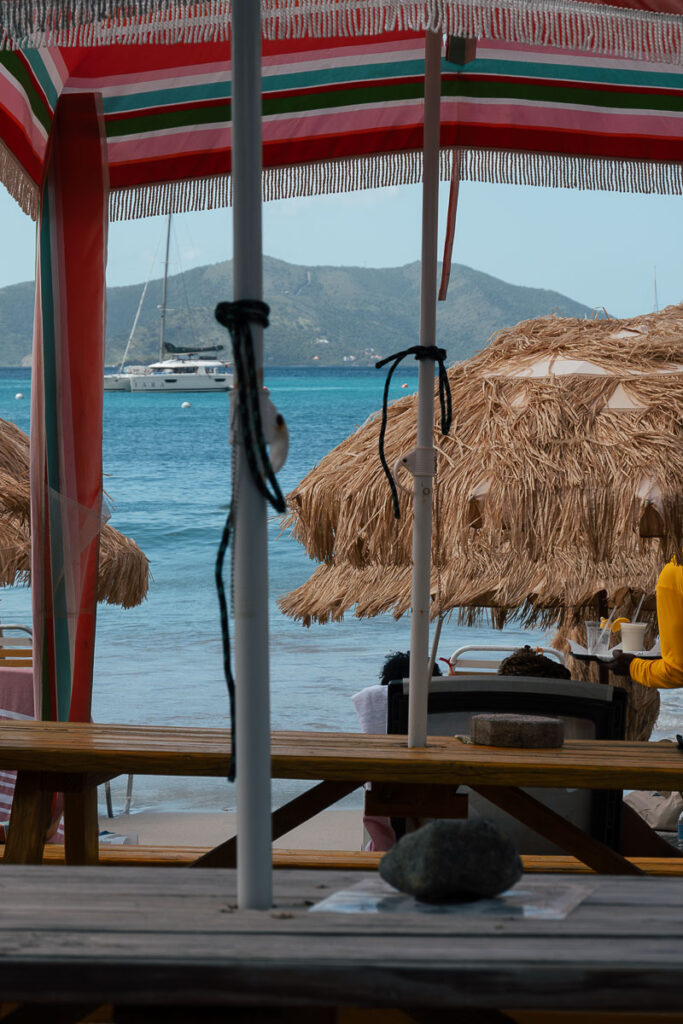 restaurant wood tables at cane garden bay beach in tortola