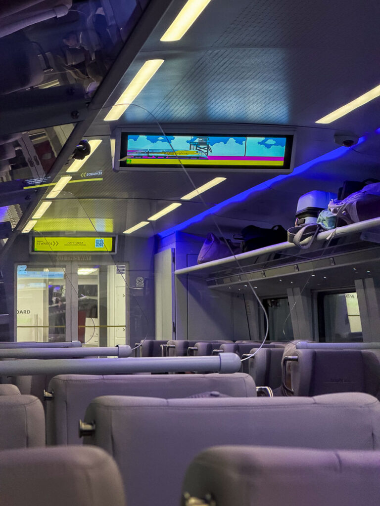 train brightline interior luggage overhead space