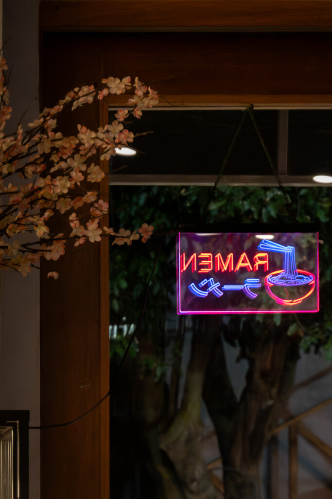 flowers and restaurant sign which is the dashi ramen in san juan