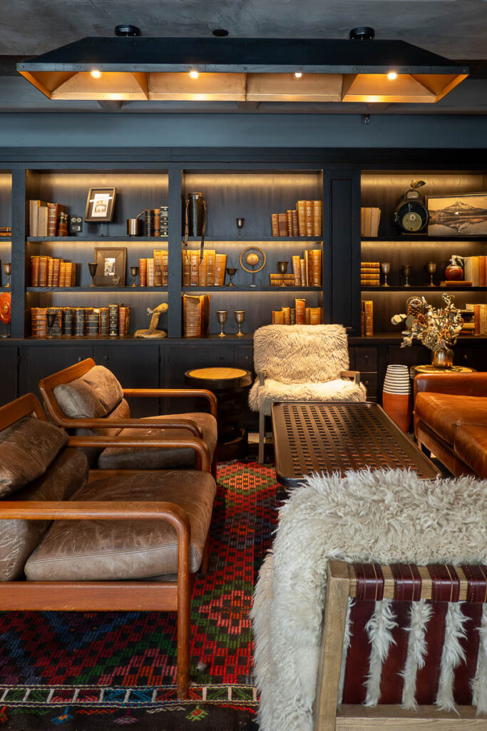 bookshelf and sofas in the Bullard Tavern Woodlark Hotel Porland Oregon