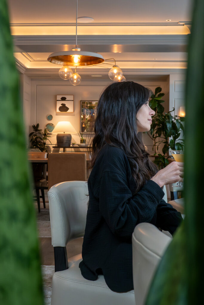 female in a hotel lobby which represents the Woodlark hotel