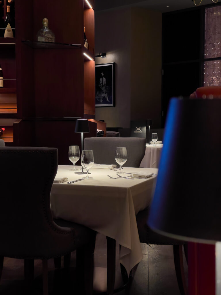 chair and table with dim light a vegan fine dining Las Vegas Crossroads Kitchen restaurant