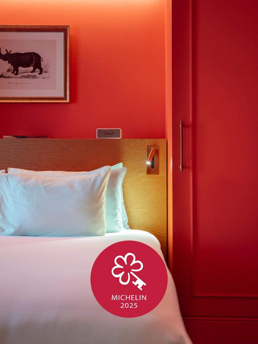 image of a bed with white sheets which represents art legacy review in Lisbon a Michelin Key hotel