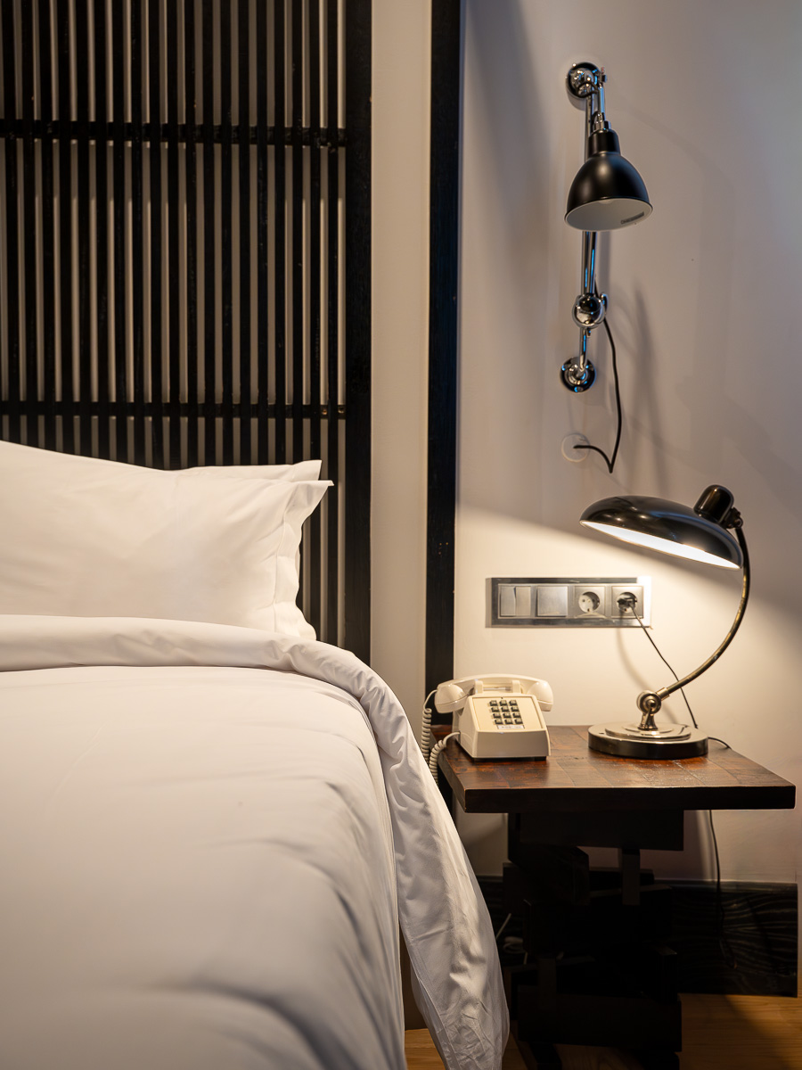 superior room bed with white comforter which represents the best boutique hotel in Lisbon