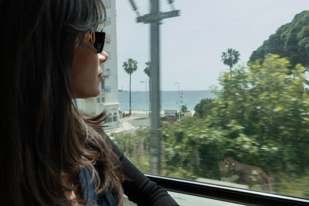 looking outside the window in the Cannes to Monaco by train